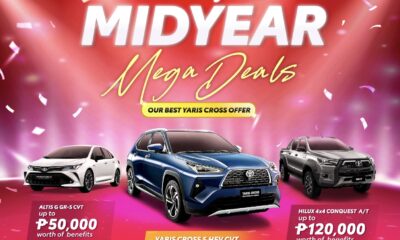Three Toyota vehicles — Altis G GR-S CVT, Yaris Cross S HEV CVT, and Hilux 4x4 Conquest A/T — featured on a red and pink confetti-themed backdrop with text announcing "The Toyota Midyear Mega Deals" and benefits of up to ₱125,000.