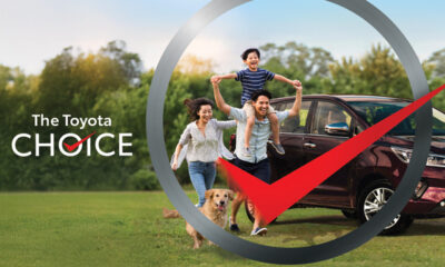 Happy Filipino family with a dog running in front of a parked Toyota MPV, symbolizing freedom of mobility and lifestyle choices, overlaid with a large checkmark and the tagline “The Toyota Choice.”