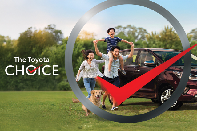 Happy Filipino family with a dog running in front of a parked Toyota MPV, symbolizing freedom of mobility and lifestyle choices, overlaid with a large checkmark and the tagline “The Toyota Choice.”