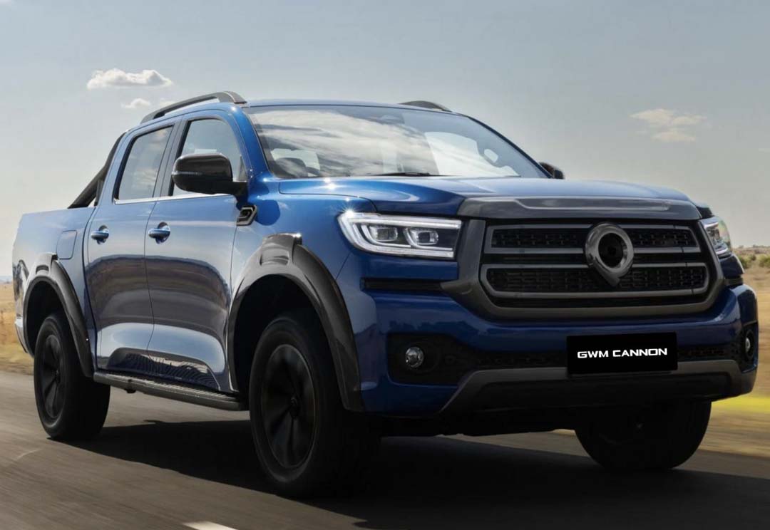 Blue GWM Cannon pickup truck driving on an open road under clear skies.