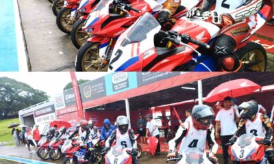 Young Filipino motorcycle racers prepare to launch from pit lane during a rainy qualifying session at the F.C.C. Honda Pilipinas Dream Cup Round 2 in Tarlac Circuit Hill.