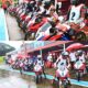 Young Filipino motorcycle racers prepare to launch from pit lane during a rainy qualifying session at the F.C.C. Honda Pilipinas Dream Cup Round 2 in Tarlac Circuit Hill.