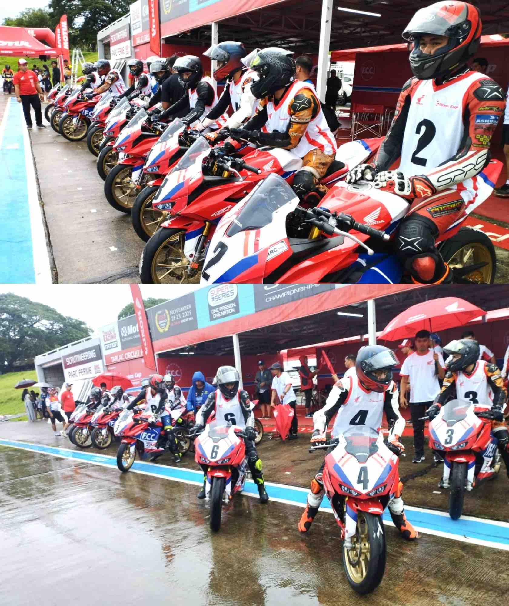 Young Filipino motorcycle racers prepare to launch from pit lane during a rainy qualifying session at the F.C.C. Honda Pilipinas Dream Cup Round 2 in Tarlac Circuit Hill.