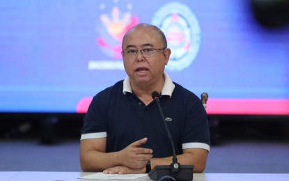 LTO official addresses the media during a press conference on replacement plate distribution.