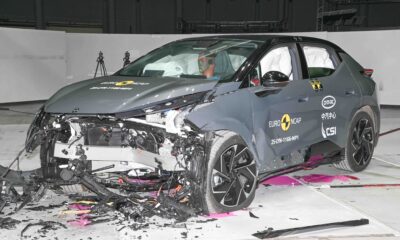 Frontal crash test of a Lynk & Co 02 electric SUV conducted by Euro NCAP, showing significant damage to the front end and deployed airbags inside the cabin.