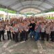 Group of Quezon City traffic enforcers and MDPPA representatives pose together during a road safety seminar under a covered outdoor venue.