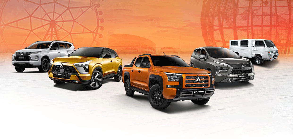 Lineup of Mitsubishi vehicles on display against an orange gradient backdrop featuring a Ferris wheel silhouette. Models shown include the Xpander, Xforce, Triton, Montero Sport, and L300.