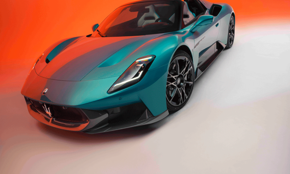 Maserati MCPURA Cielo in Ai Aqua Rainbow color against a vivid orange gradient background