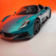 Maserati MCPURA Cielo in Ai Aqua Rainbow color against a vivid orange gradient background