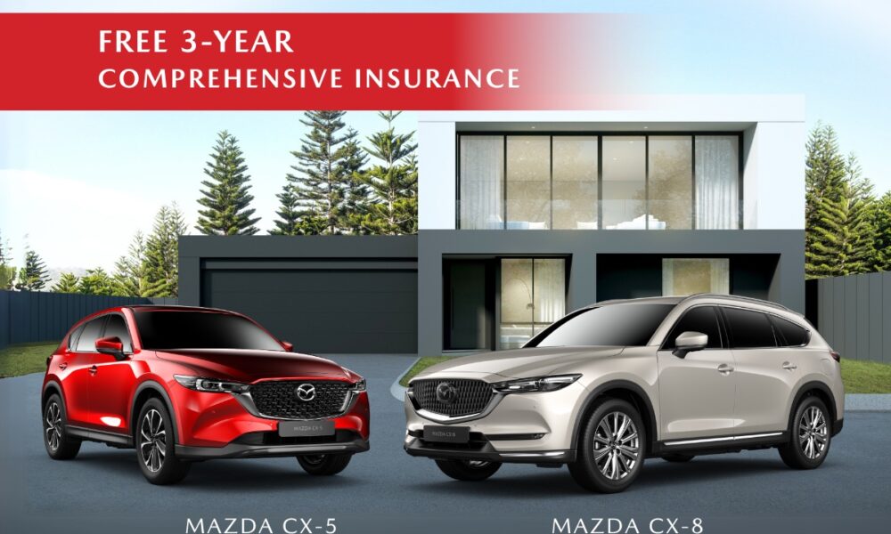 Mazda CX-5 and CX-8 parked in front of a modern home with promo details offering ₱199K all-in downpayment and free 3-year comprehensive insurance.