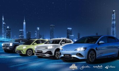 Four BYD electric vehicles—the Shark 6, Seagull, Atto 3, and Seal 5—parked in front of a futuristic city skyline at night, with Ayala Malls logos beneath them.