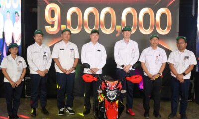 Executives of Honda Philippines, Inc. stand beside the commemorative 9 millionth unit motorcycle, the XRM125 DS, during the HPI Production Milestone Ceremony in Batangas.