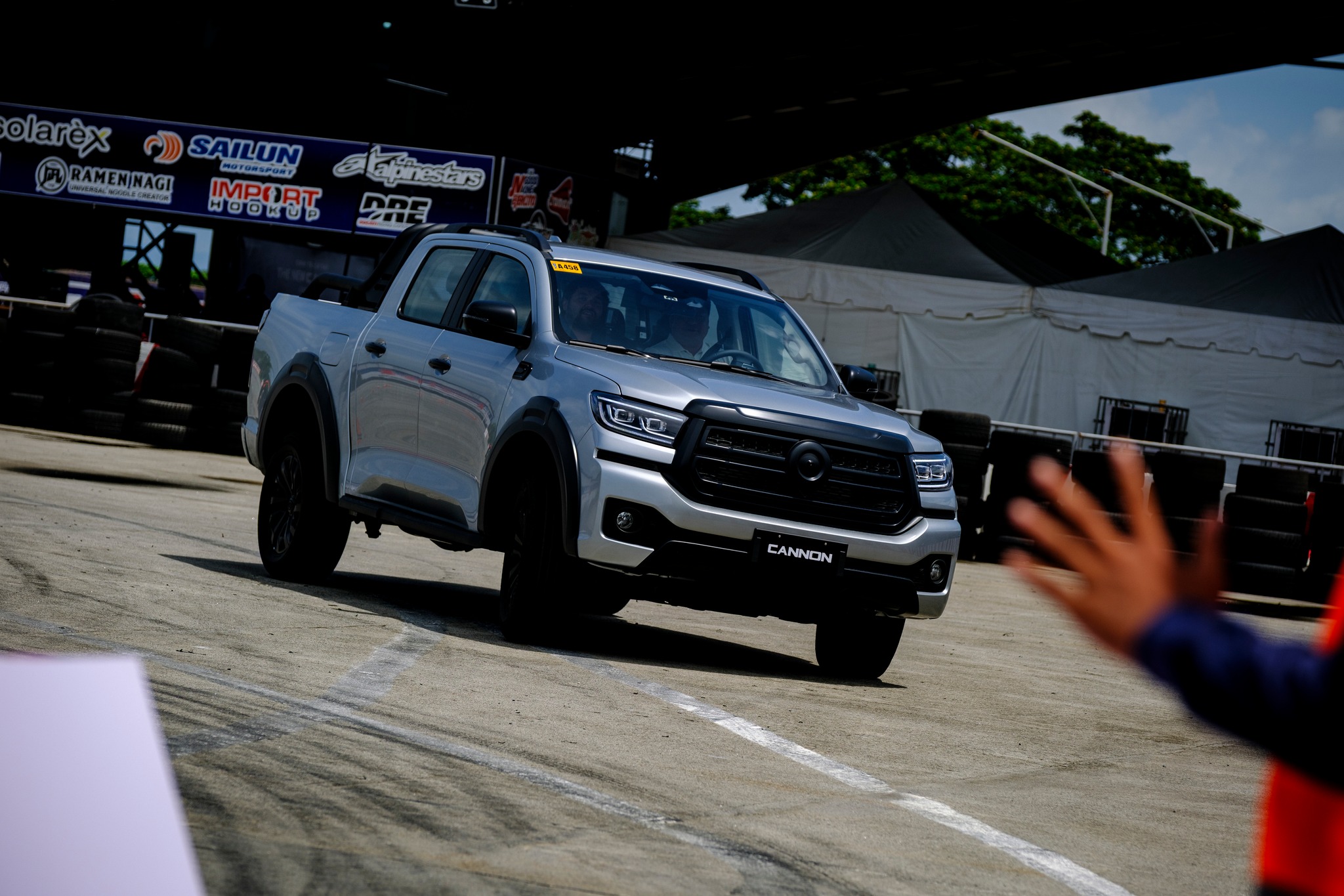 Silver GWM Cannon pickup truck maneuvering on a closed track during a driving event in the Philippines.