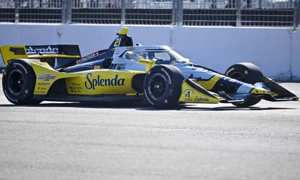 Christian Rasmussen driving the yellow-and-black Ed Carpenter Racing IndyCar at speed during the Milwaukee Mile 250.