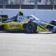 Christian Rasmussen driving the yellow-and-black Ed Carpenter Racing IndyCar at speed during the Milwaukee Mile 250.