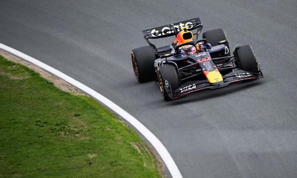A Formula One car speeds through a corner at Zandvoort during Dutch Grand Prix weekend.