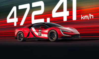 Red YANGWANG U9 Track Edition supercar speeding on track with glowing 472.41 km/h text in the background, highlighting its world record top speed.