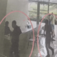CCTV still image showing suspected fixers inside an office, highlighted with red circles for identification.