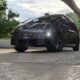 Li Auto MEGA parked outdoors, showcasing its sleek design and futuristic look under natural light.