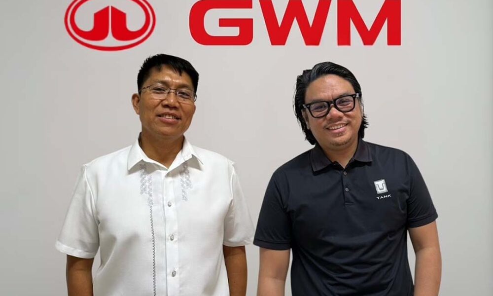 Two newly appointed executives of GWM Philippines, Jude Racadio (left) and Vincent Marquez (right), standing in front of the GWM logo during their official introduction.