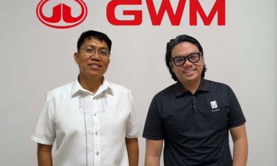 Two newly appointed executives of GWM Philippines, Jude Racadio (left) and Vincent Marquez (right), standing in front of the GWM logo during their official introduction.