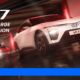 Two VinFast VF 7 electric SUVs—one in red, one in white—racing through a sleek, futuristic tunnel under dramatic red lighting, with motion blur emphasizing speed and power.