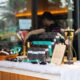 A display of Lynk & Co personalized giveaways, including passport holders and key holders, arranged on a decorated table at the Lynk Ups event.
