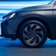 Front wheel and headlamp detail of the all-new Toyota ATIV under blue lighting