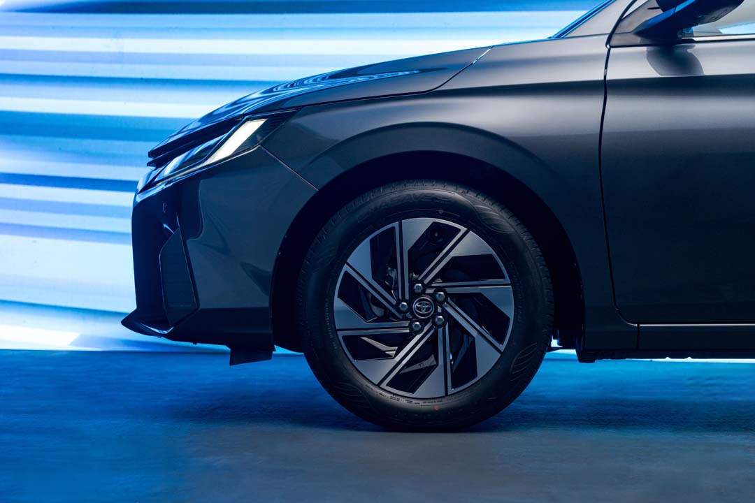 Front wheel and headlamp detail of the all-new Toyota ATIV under blue lighting