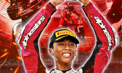 Alfonsi Daquigan celebrates his double podium win at the Idemitsu Asia Talent Cup Round 5 in Mandalika, Indonesia, holding his trophy with both hands while Honda and Asia Talent Cup logos appear in the background.