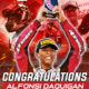 Alfonsi Daquigan celebrates his double podium win at the Idemitsu Asia Talent Cup Round 5 in Mandalika, Indonesia, holding his trophy with both hands while Honda and Asia Talent Cup logos appear in the background.