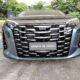 Front view of the BYD eMAX 9 DM-i showing its large chrome grille and sleek LED headlamps at Ayala Greenfield Golf & Leisure Club in Calamba, Laguna.