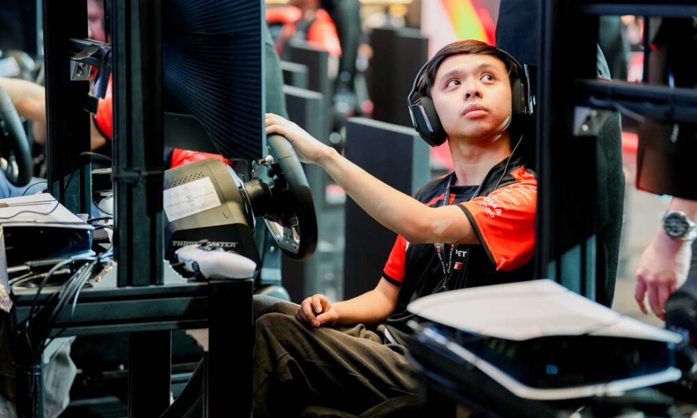 Victor Ancheta focuses on his racing simulator setup during the TGR Philippines eSports GT Championship 2025 finals at Ayala Malls Manila Bay.