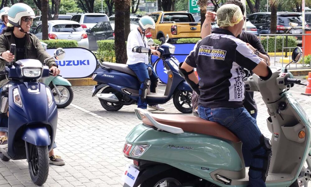 Participants test ride the new Suzuki Access scooters during the “All Access” launch event at Market! Market! in Taguig City.